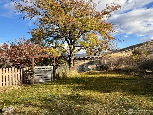 a view of a patio with a yard