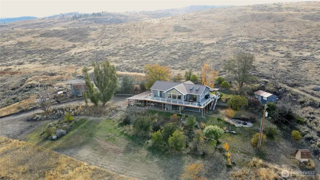 a aerial view of a house with a yard