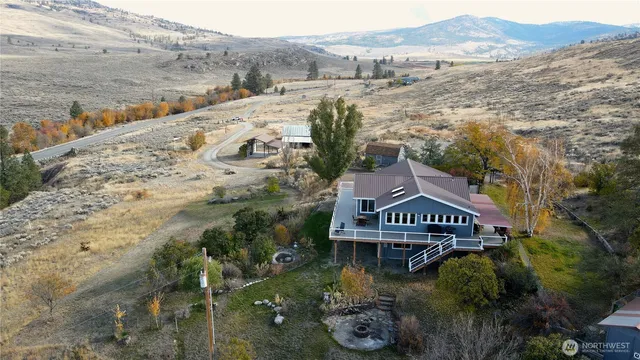 an aerial view of houses with yard