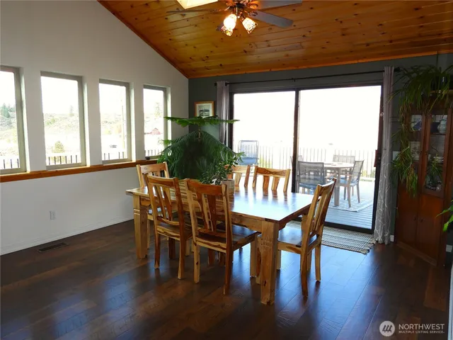 a dining room with furniture window wooden floor