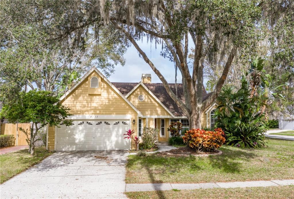 7333 Hideaway Trail New Port Richey, FL 34655 - Photo 1 of 1 a front view of a house with garden