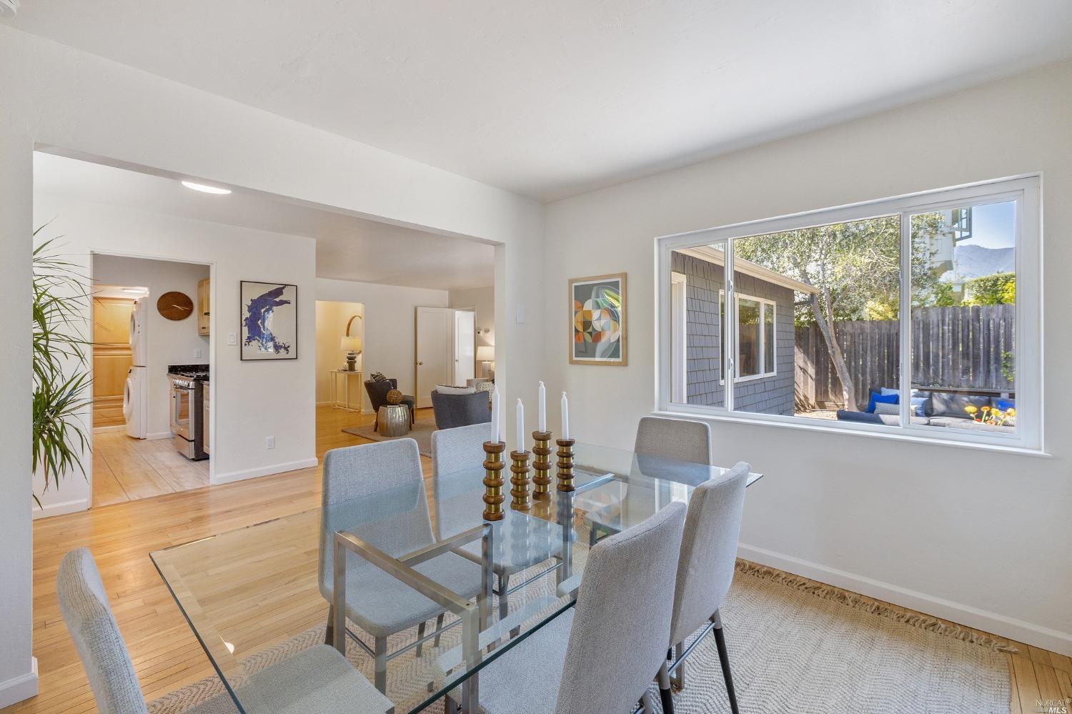 33 Matilda Avenue Mill Valley, CA 94941 - Photo 13 of 31 a dining room with furniture a chandelier and wooden floor