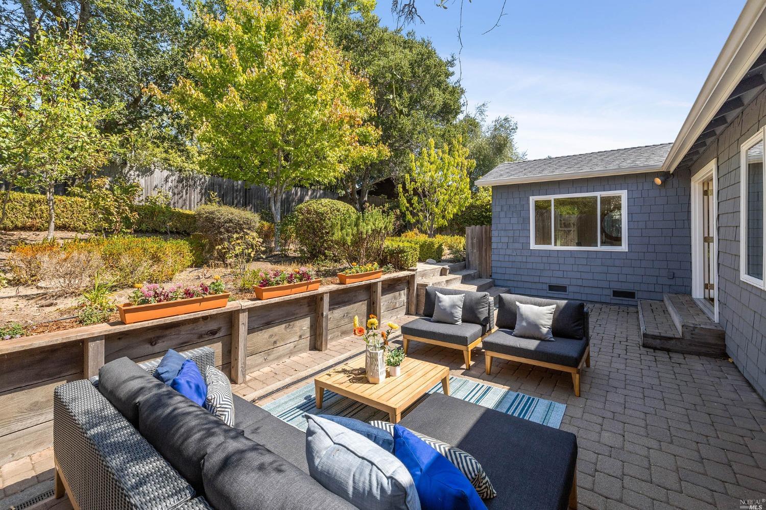 33 Matilda Avenue Mill Valley, CA 94941 - Photo 25 of 31 a view of a patio with couches and a table and chairs with wooden floor