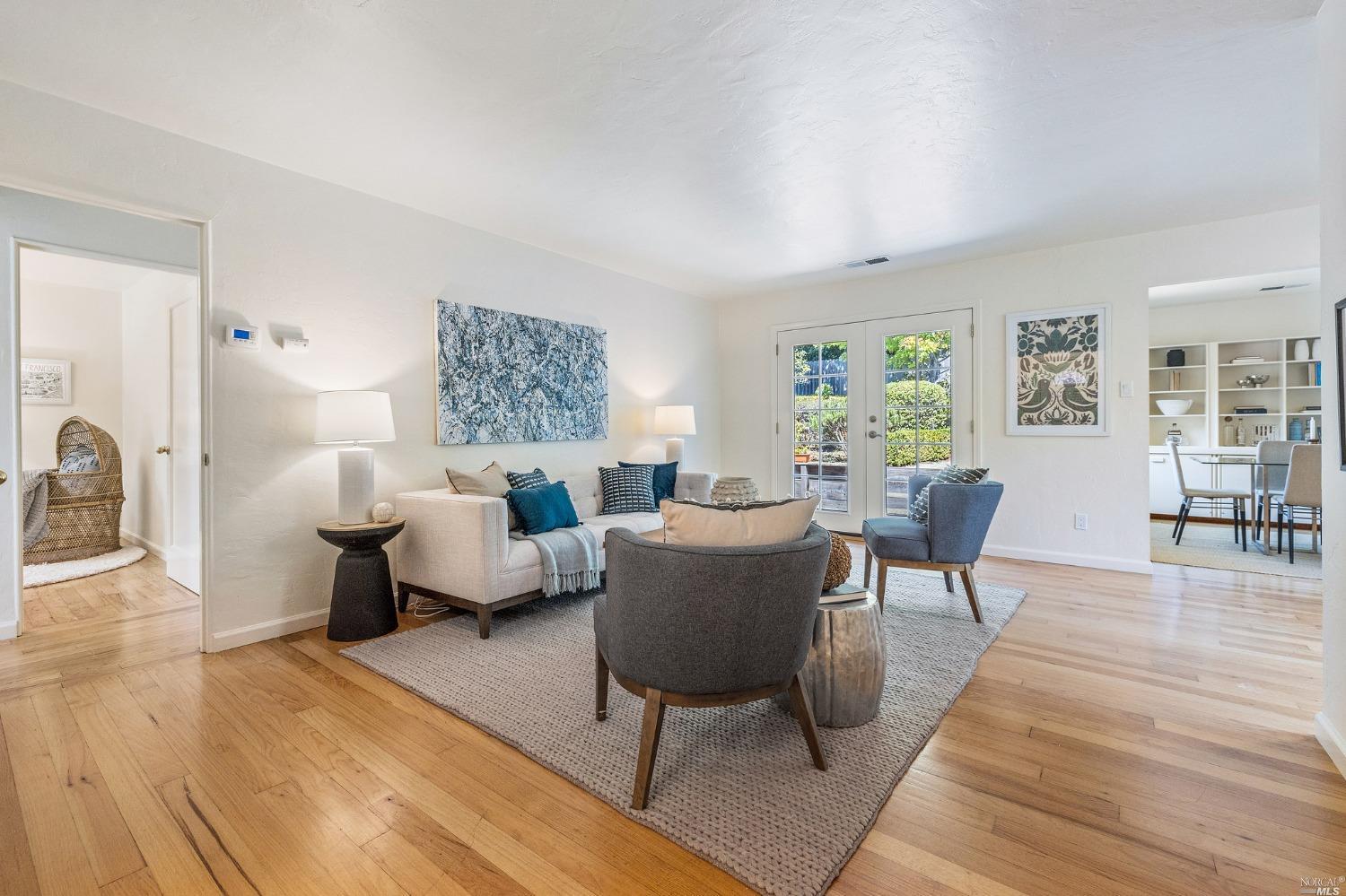 33 Matilda Avenue Mill Valley, CA 94941 - Photo 4 of 31 a living room with furniture and a wooden floor