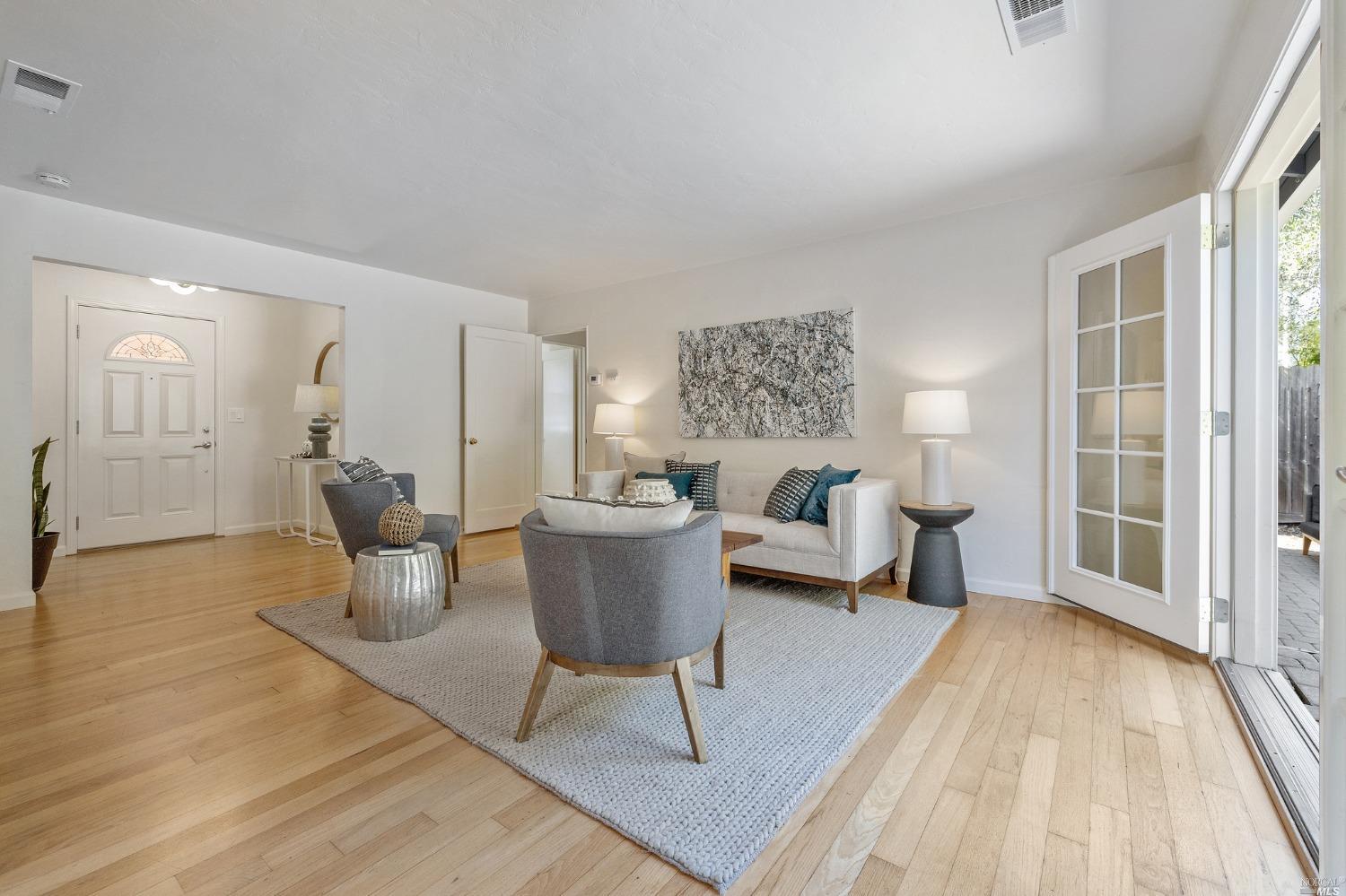 33 Matilda Avenue Mill Valley, CA 94941 - Photo 7 of 31 a living room with furniture and a large window