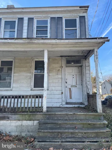 a front view of a house with a garage