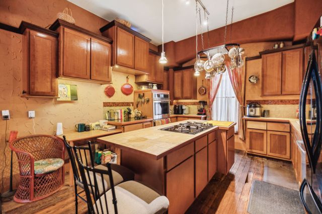 a kitchen that has a cabinets and a stove
