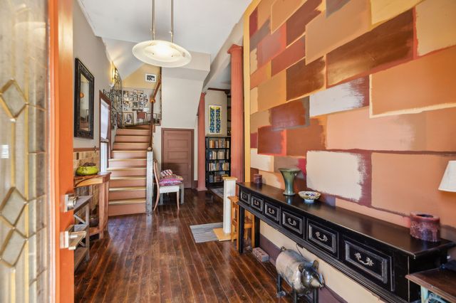 wooden floor in a gallery next to a window