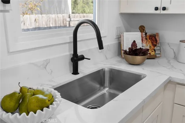 a kitchen with a sink and a stove