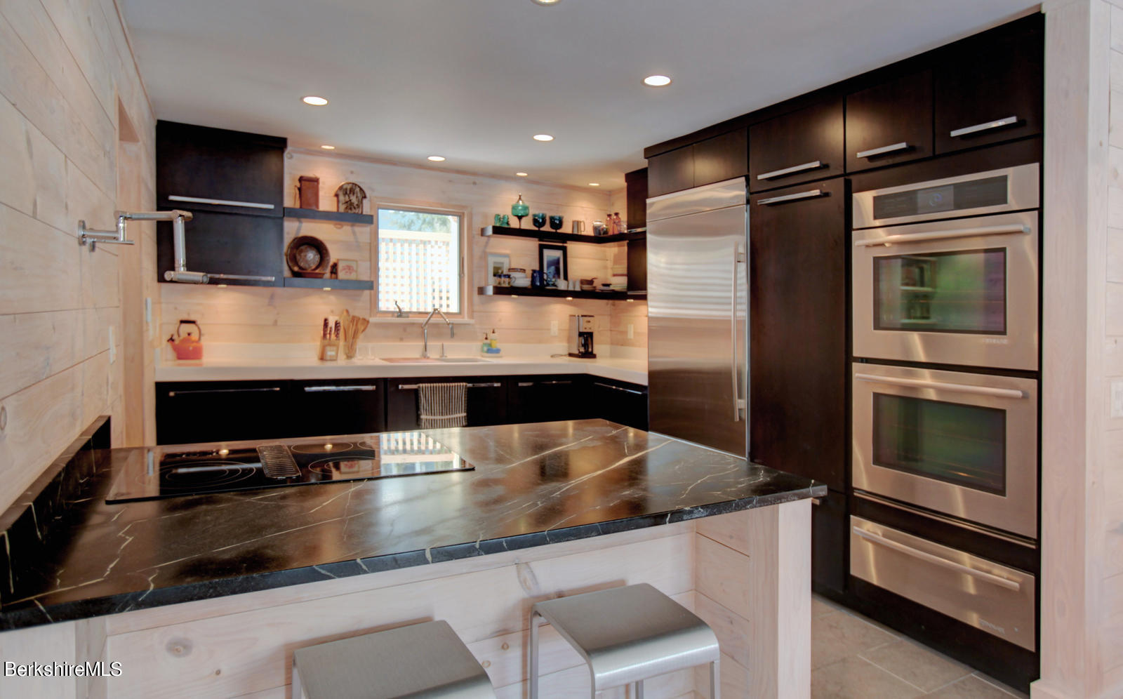 42 Rhoen Road Austerlitz, NY 12017 - Photo 16 of 43 a kitchen with stainless steel appliances granite countertop a sink and a refrigerator