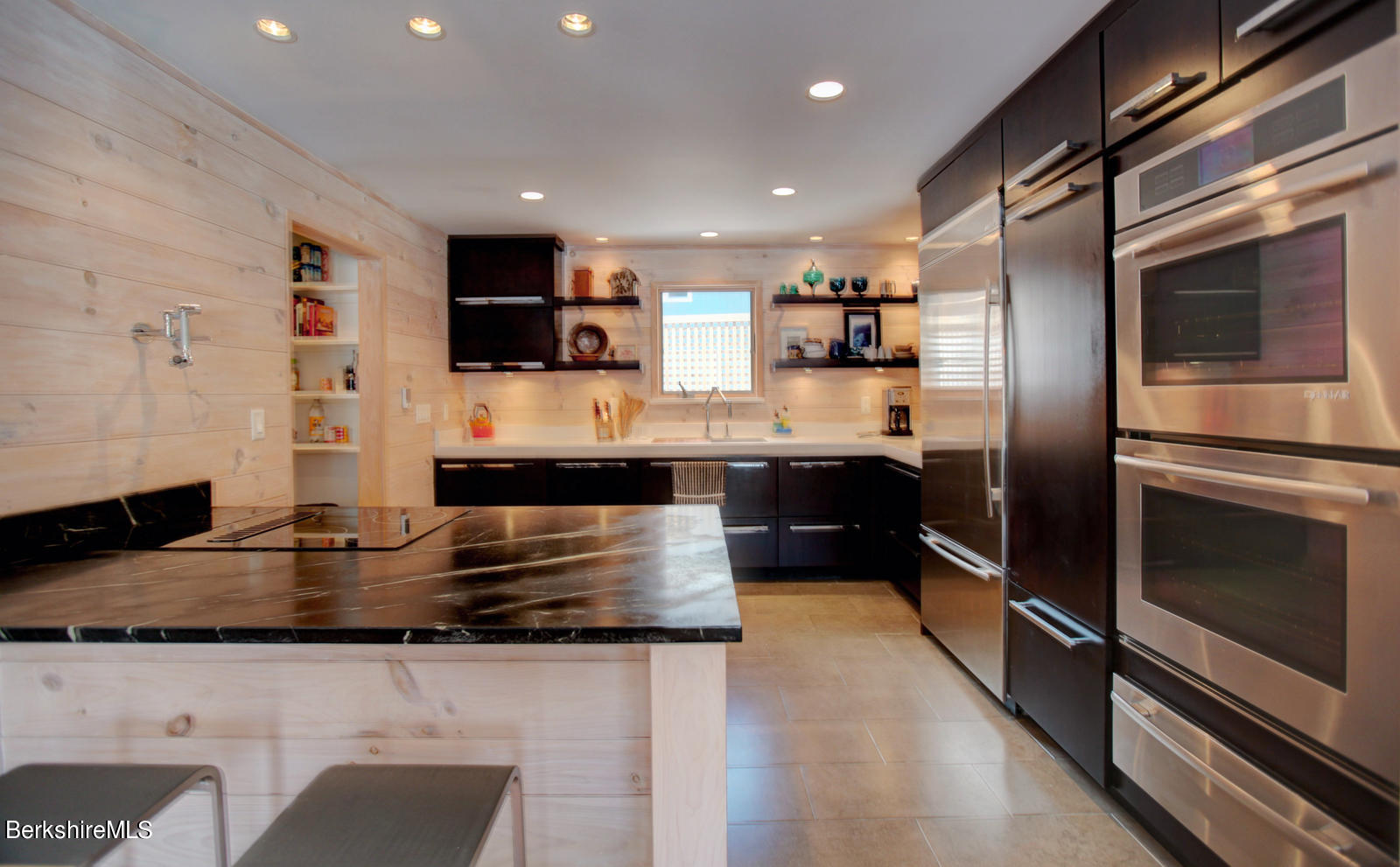 42 Rhoen Road Austerlitz, NY 12017 - Photo 17 of 43 a kitchen with stainless steel appliances granite countertop a refrigerator and a stove