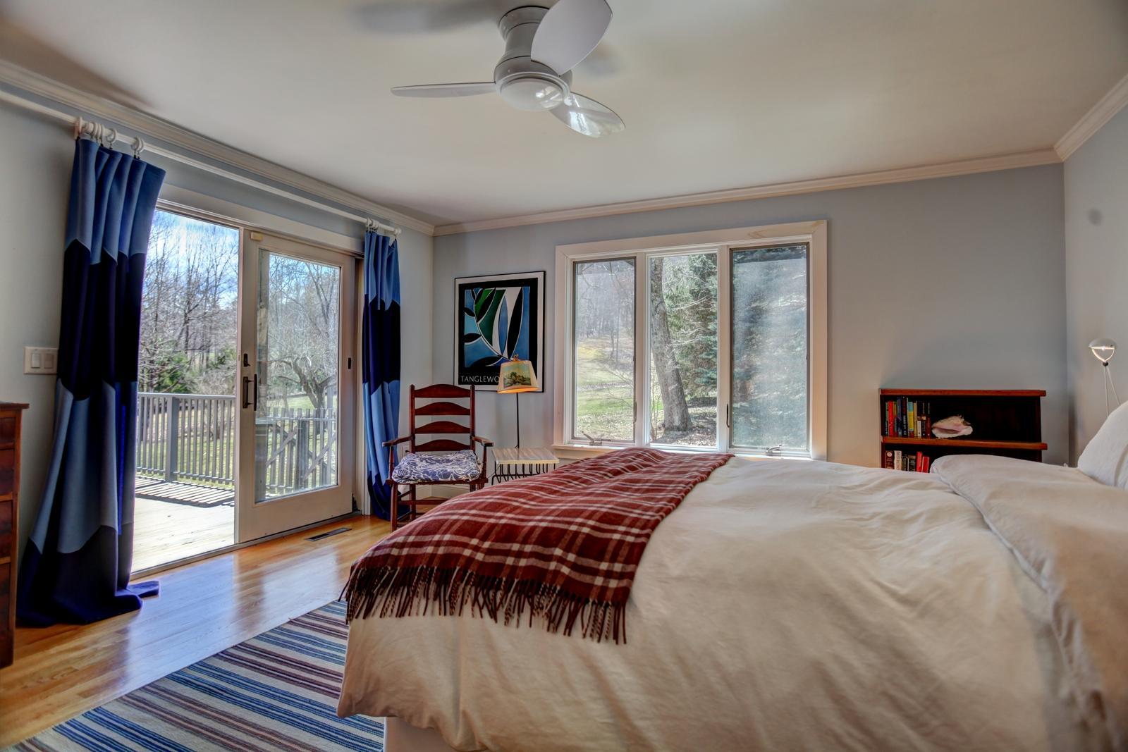 42 Rhoen Road Austerlitz, NY 12017 - Photo 23 of 43 a spacious bedroom with a bed and a large window