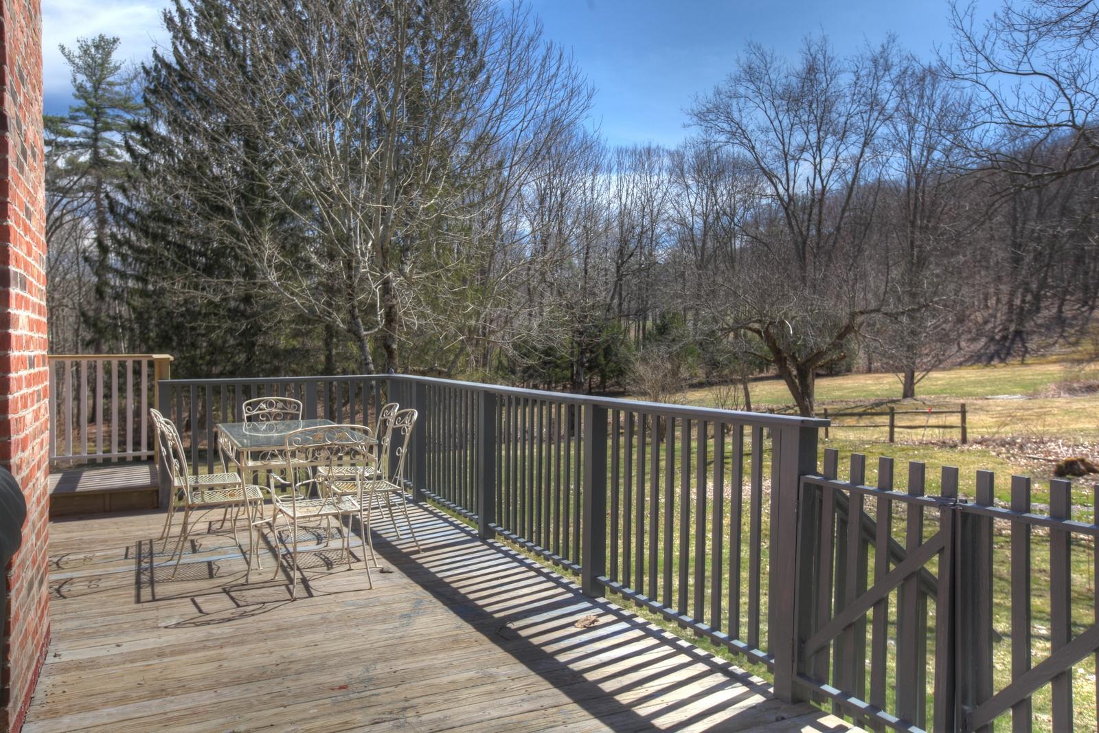 42 Rhoen Road Austerlitz, NY 12017 - Photo 24 of 43 a view of balcony with wooden floor and fence