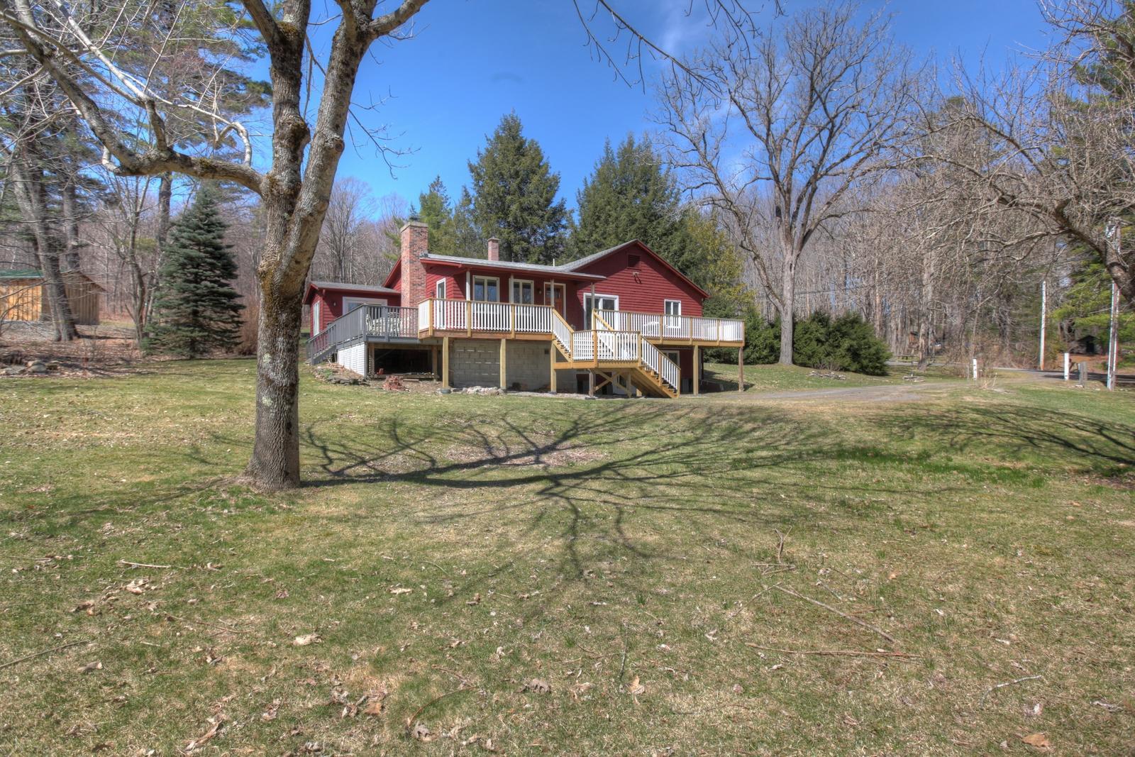 42 Rhoen Road Austerlitz, NY 12017 - Photo 42 of 43 a white house that has a tree in front of it