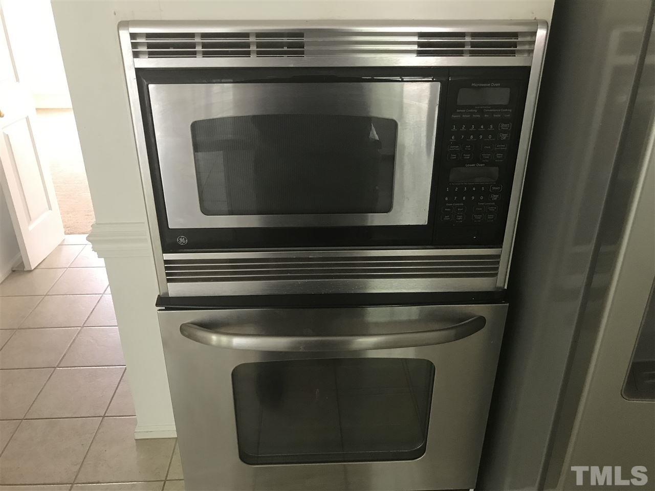 3205 Coppedge Lane Raleigh, NC 27616 - Photo 12 of 20 a stove top oven sitting inside of a kitchen