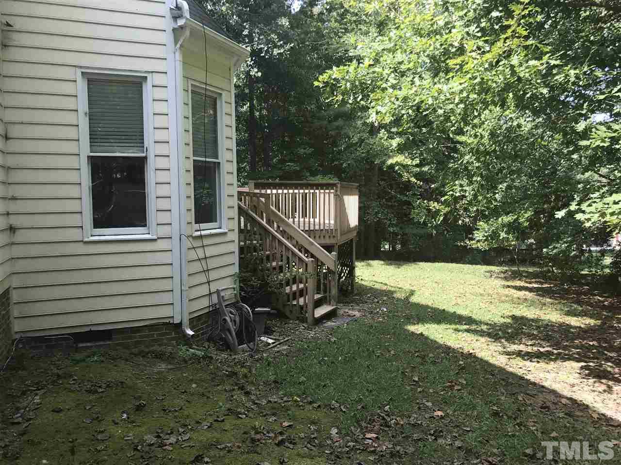 3205 Coppedge Lane Raleigh, NC 27616 - Photo 17 of 20 a view of a wooden bench in the yard