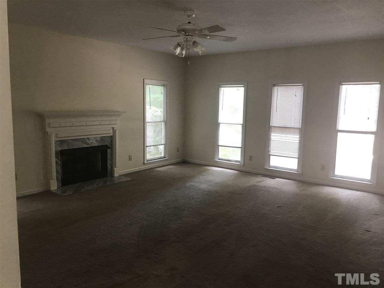 3205 Coppedge Lane Raleigh, NC 27616 - Photo 6 of 20 a view of empty room with a fireplace