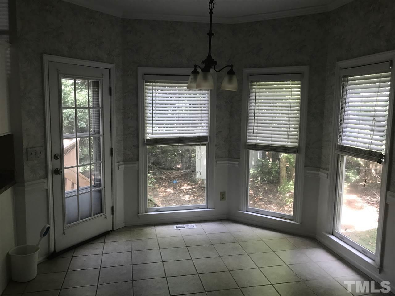 3205 Coppedge Lane Raleigh, NC 27616 - Photo 9 of 20 an empty room with windows and outdoor view