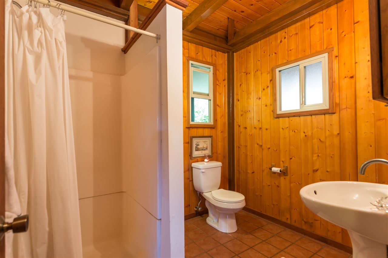 73 Door Of Faith Road Haiku, HI 96708 - Photo 12 of 30 a bathroom with a toilet a sink and shower