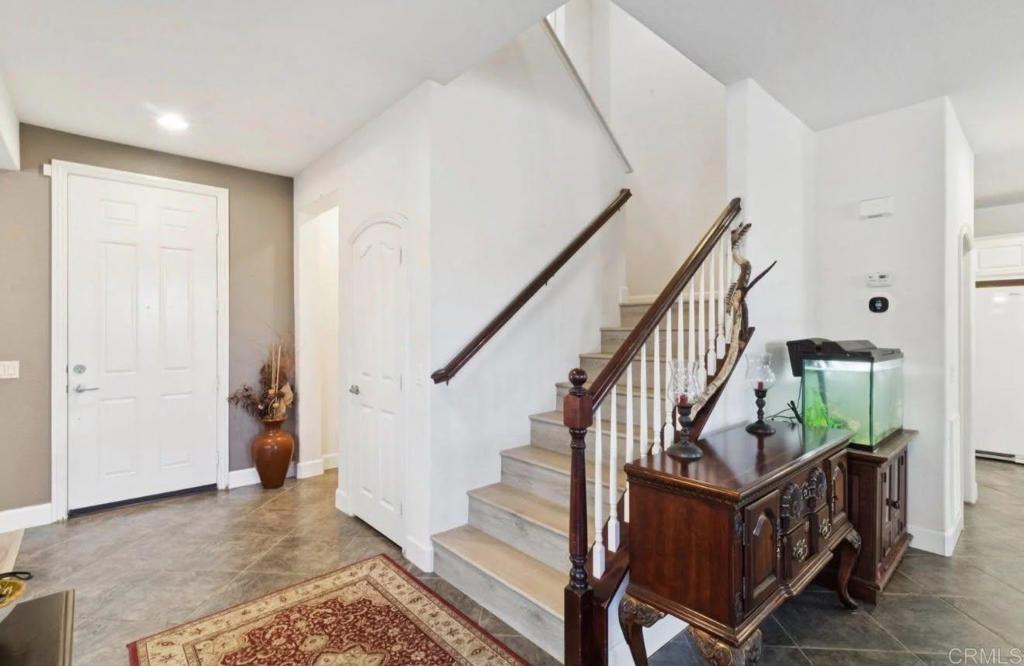 1234 Old Janal Ranch Road Chula Vista, CA 91915 - Photo 10 of 34 a view of entryway with wooden floor and stairs