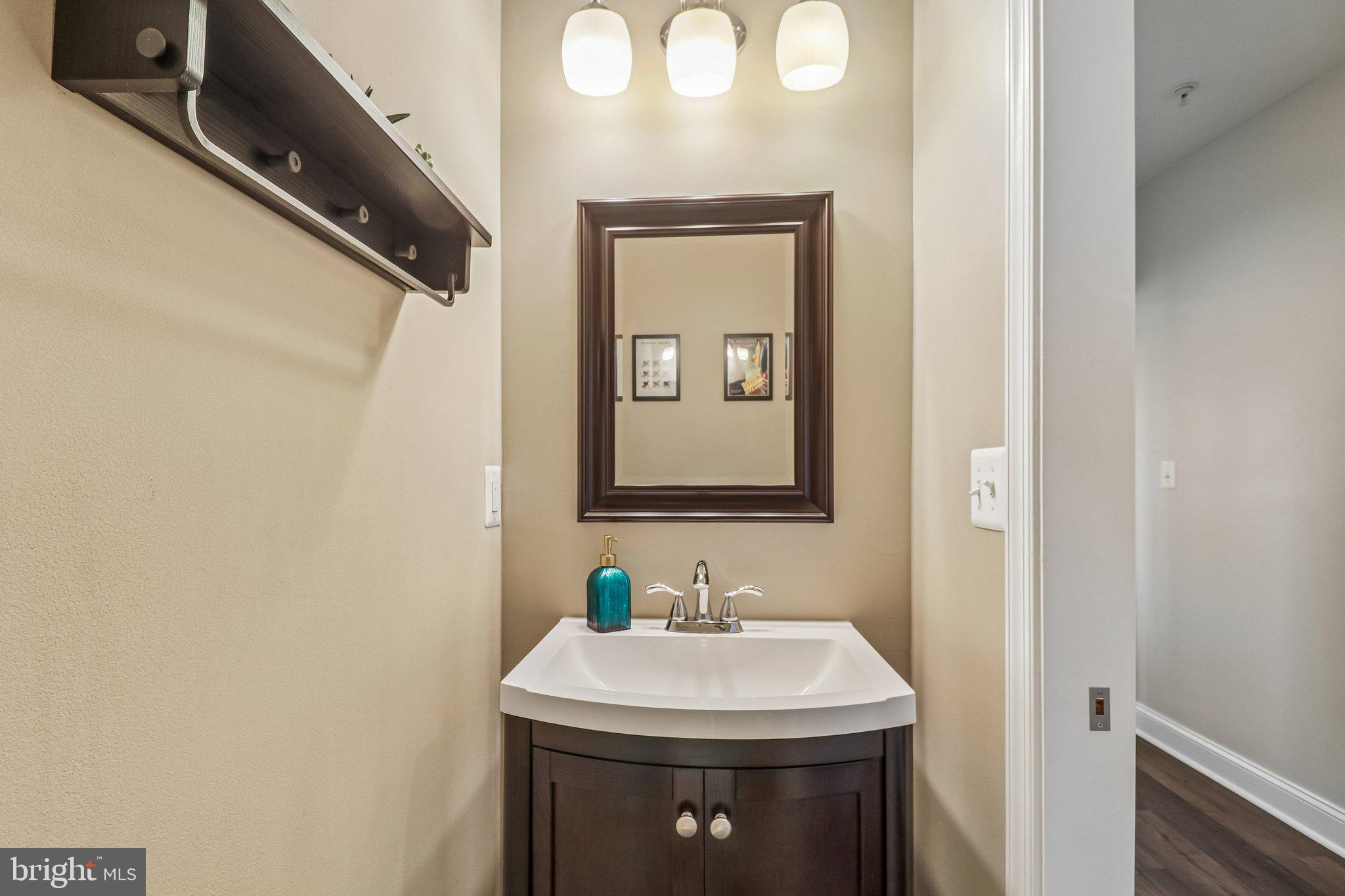 233 S Street Northeast, Unit 5 Washington, DC 20002 - Photo 23 of 41 Elegant half-bath with modern charm.