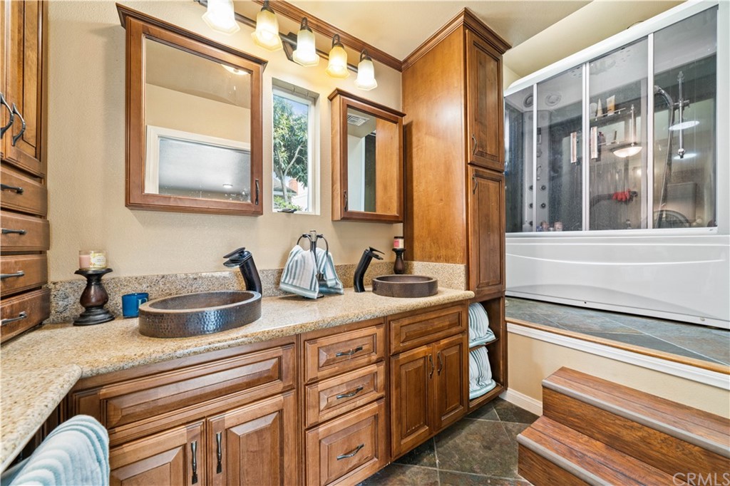 4909 El Molino Avenue Riverside, CA 92504 - Photo 11 of 33 a kitchen with stainless steel appliances granite countertop a sink and cabinets