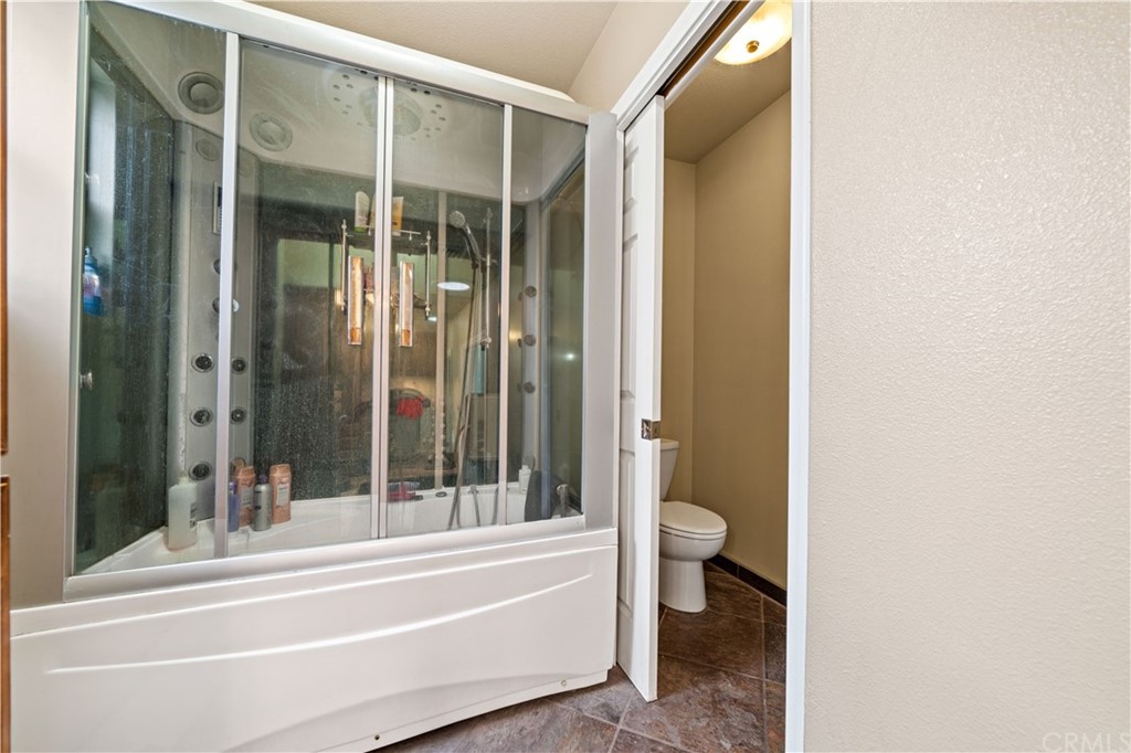 4909 El Molino Avenue Riverside, CA 92504 - Photo 13 of 33 a bathroom with a bathtub and a toilet