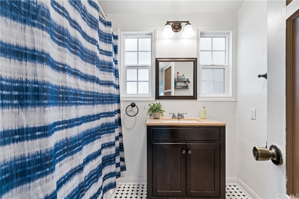 4909 El Molino Avenue Riverside, CA 92504 - Photo 17 of 33 a bathroom with a sink and a mirror