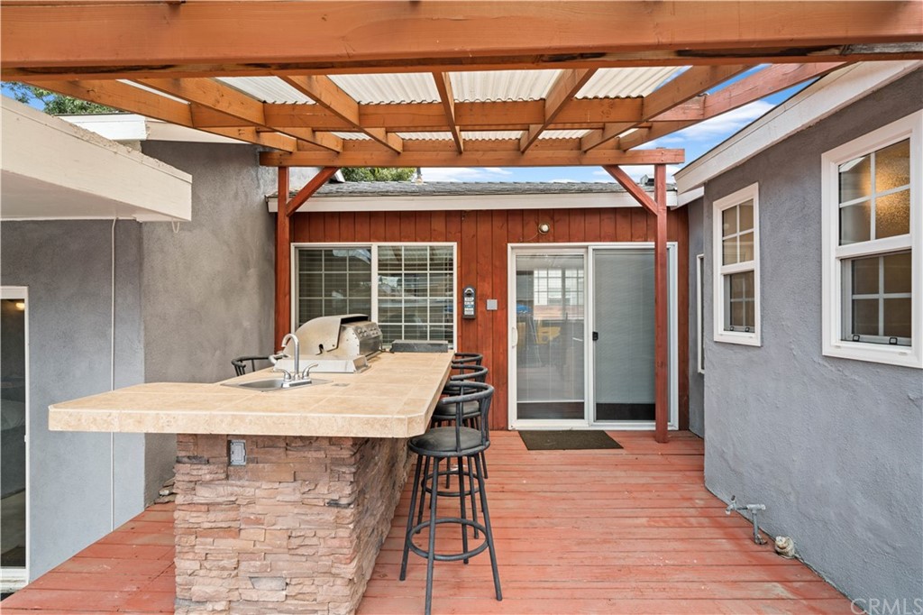 4909 El Molino Avenue Riverside, CA 92504 - Photo 18 of 33 a view of a patio with table and chairs
