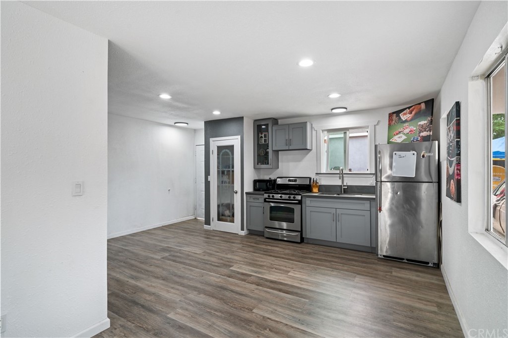 4909 El Molino Avenue Riverside, CA 92504 - Photo 20 of 33 a kitchen with stainless steel appliances a refrigerator and a stove top oven