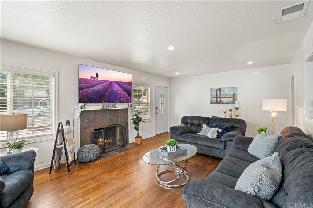 4909 El Molino Avenue Riverside, CA 92504 - Photo 2 of 33 a living room with furniture and a fireplace