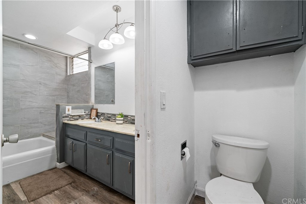 4909 El Molino Avenue Riverside, CA 92504 - Photo 24 of 33 a bathroom with a toilet a sink and bathtub