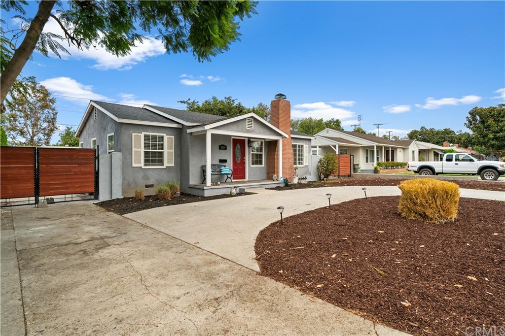 4909 El Molino Avenue Riverside, CA 92504 - Photo 31 of 33 a front view of a house with a garden
