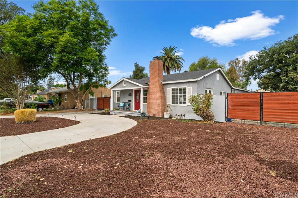 4909 El Molino Avenue Riverside, CA 92504 - Photo 32 of 33 a front view of a house with yard and trees