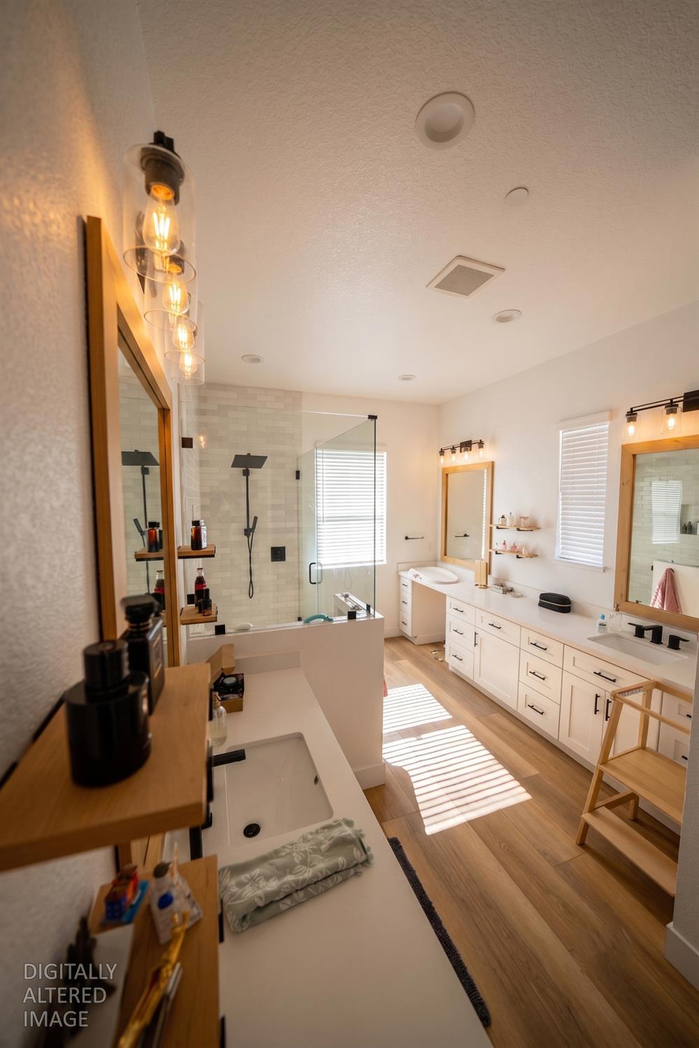 16464 Fox Road Lodi, CA 95240 - Photo 13 of 18 Spacious walk-in shower featuring floor-to-ceiling tile, frameless glass, and modern designer finishes.