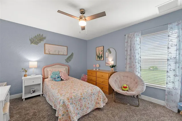 a bedroom with bed and window