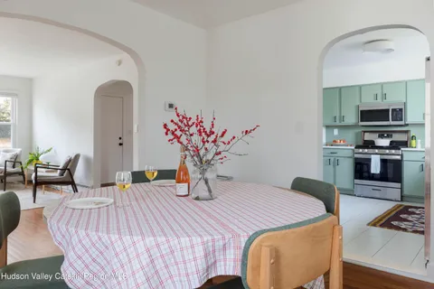 a bedroom with a bed a table and chair