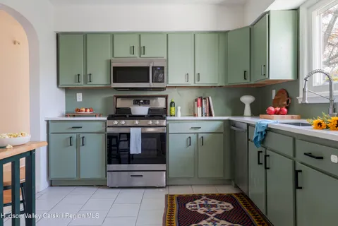 a kitchen with stainless steel appliances a stove and a refrigerator