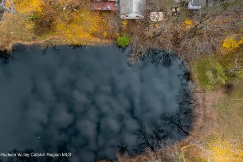 a view of lake with green space