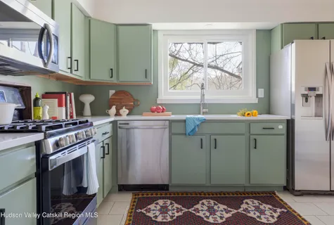 a kitchen with a sink stove and refrigerator