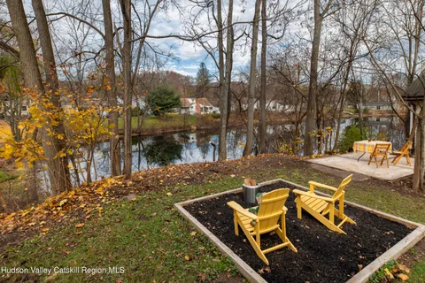 a view of a backyard with sitting area