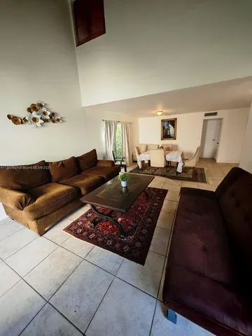 a living room with furniture and a couch