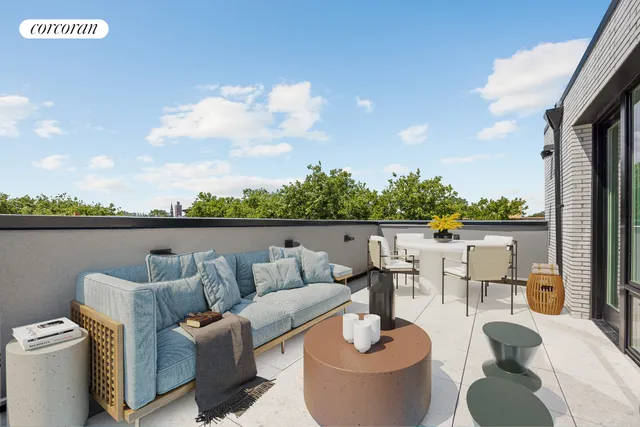 a view of a bedroom with workspace and large windows