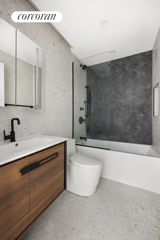 a outdoor living room with furniture and a floor to ceiling window