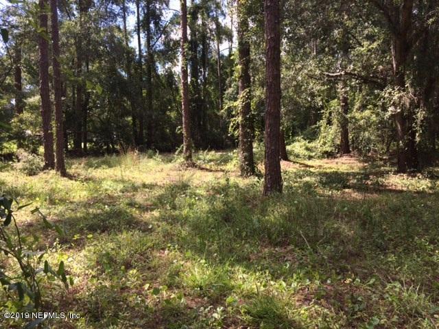3241 Stanley Drive St. Augustine, FL 32092 - Photo 2 of 8 a view of a yard with large trees