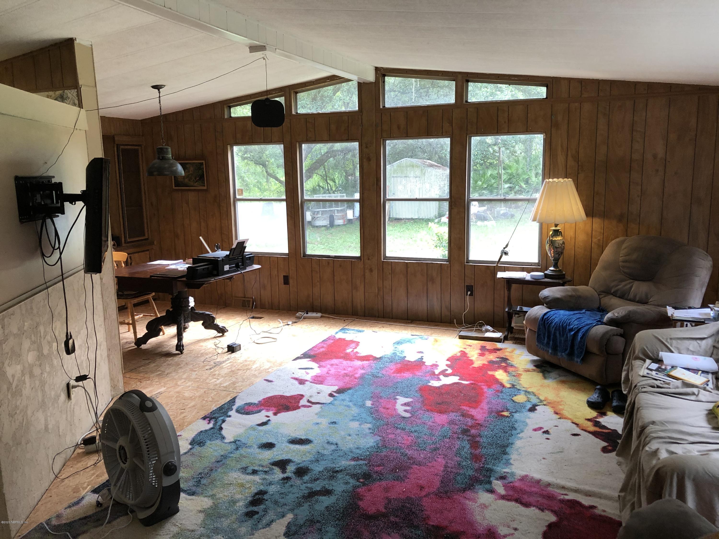 3241 Stanley Drive St. Augustine, FL 32092 - Photo 5 of 8 a bed room with a bed and a couch