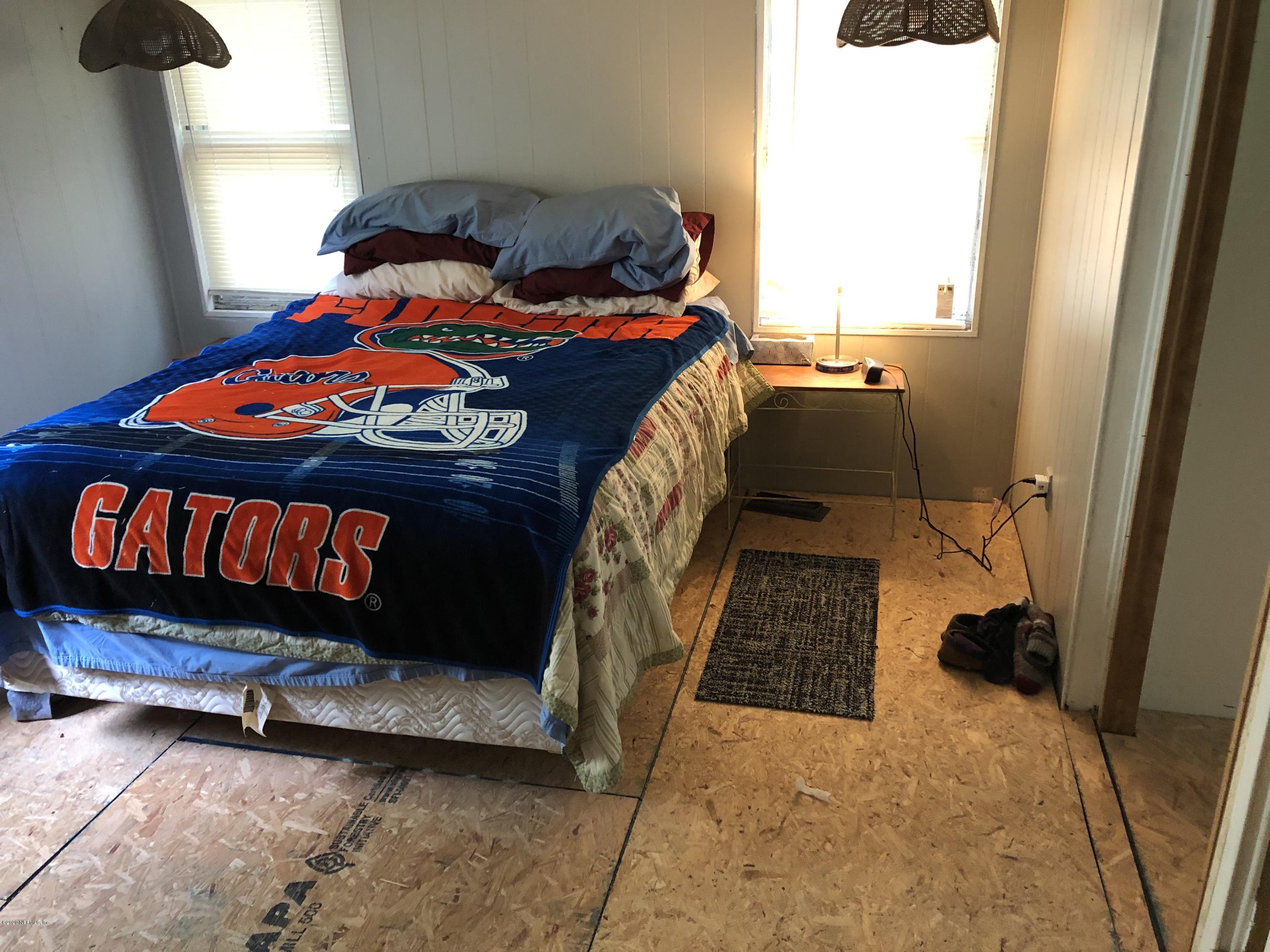 3241 Stanley Drive St. Augustine, FL 32092 - Photo 8 of 8 a bedroom with a bed and a window