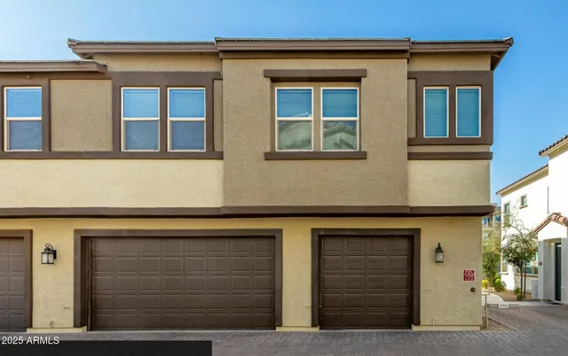 a large kitchen with cabinets appliances and a dining table
