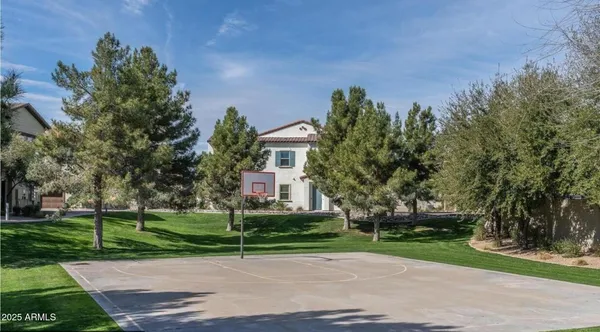 a view of a house with a backyard porch and sitting area
