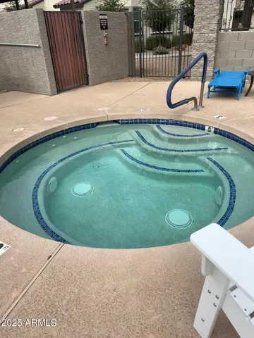 a view of a swimming pool with a yard